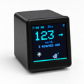 Black GlycoFox desktop glucose display showing a sample reading and animated fox